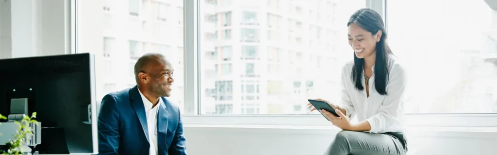 Financial professionals reviewing information together in an office